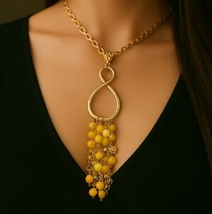 Gold Teardrop Infinity Tassel Necklace — Multi‑Strand Yellow Bead Accent Pendant